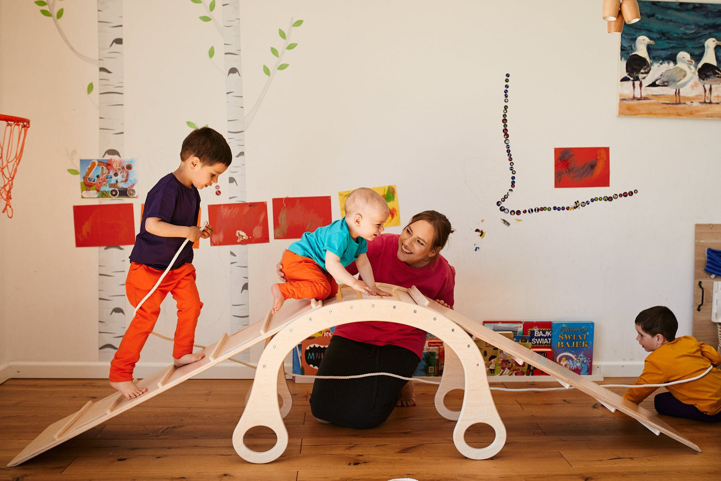 children playing on the good wood rocker with slider