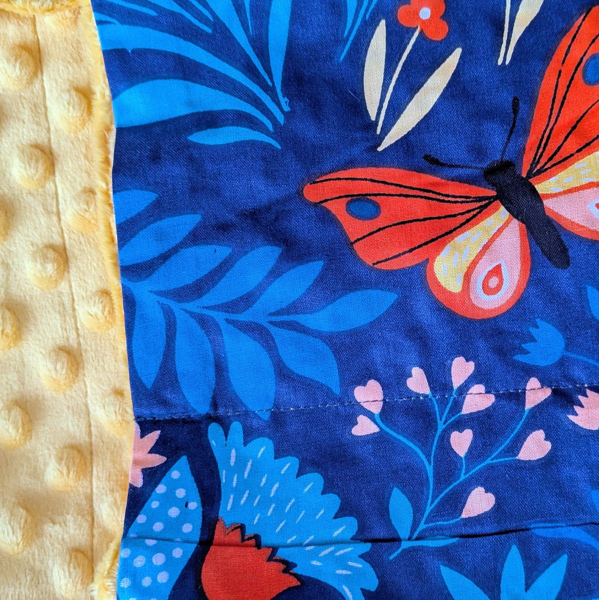 Close-up of a fabric with butterfly design on a blue background