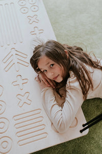 girl resting on SENSORY PLATFORM- GOOD WOOD