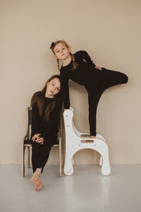 GIRLS PLAYING ON GOOD WOOD CHAIRS IN WHITE AND BLACK