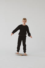 Carica l&#39;immagine nel visualizzatore di Gallery, A BOY BALANCING ON THE GREY BALANCE BOARD / TRICK BOARD FOR KIDS- GOOD WOOD